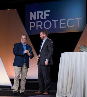 Cy Fenton receiving the Retail Cybersecurity Leadership Award at NRF PROTECT 2023.. 